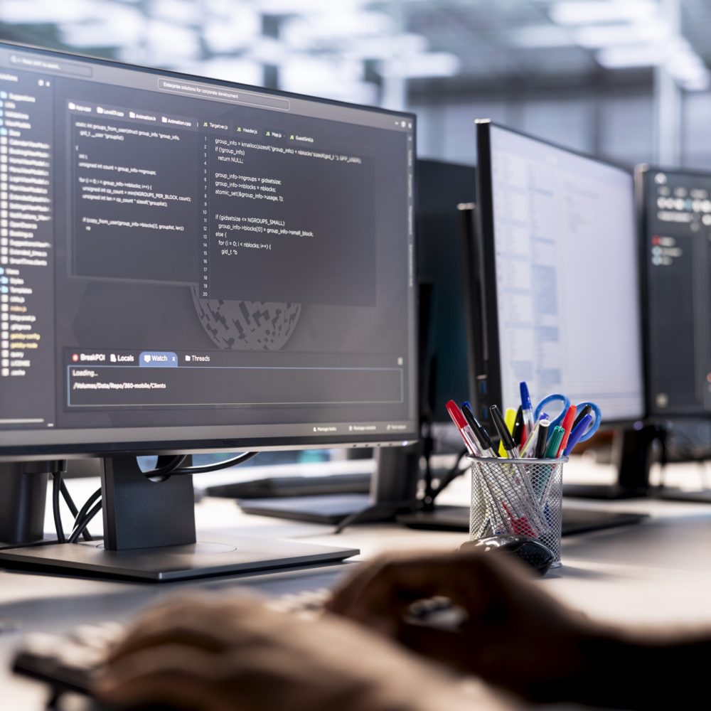 Data center technician using programming languages on PC to construct algorithms and build applications. Close up of server hub IT professional debugging and optimizing code